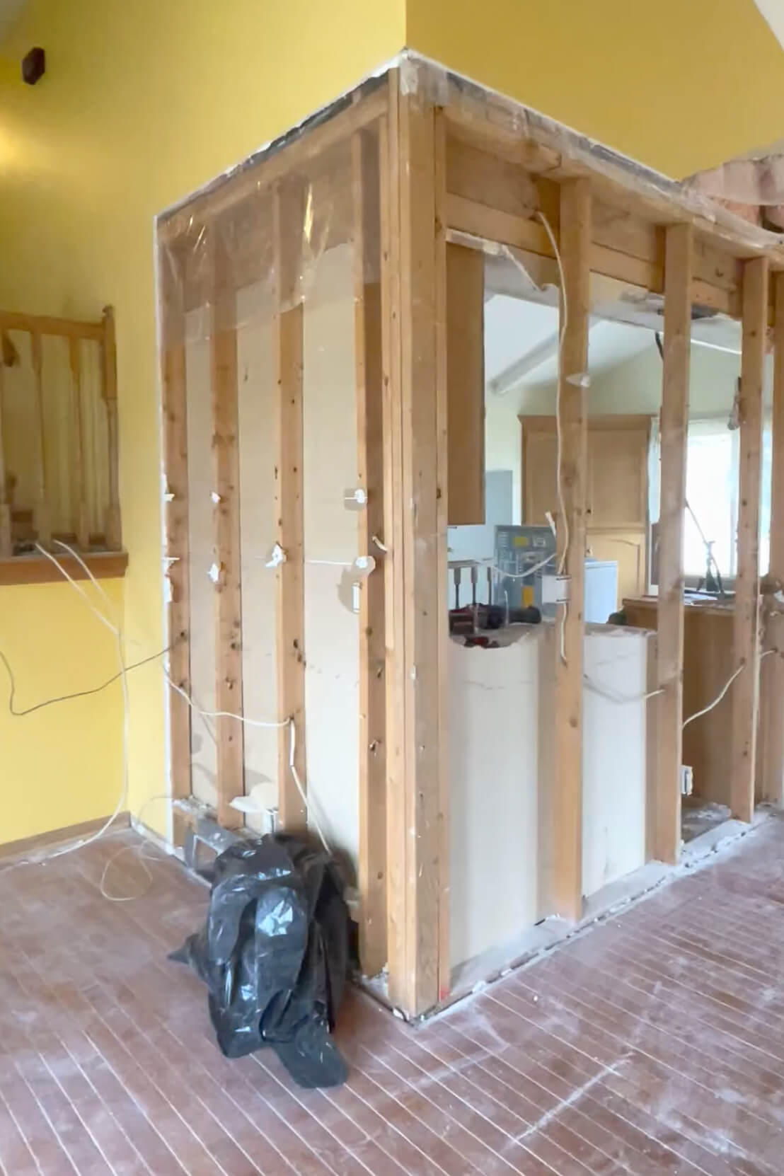 Removing drywall for kitchen remodel.
